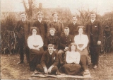 KINGSLEY THOMAS (family picture, Thomas front row left, surrounded by his parents, brothers and sisters, 1912)