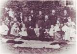 ANDREW ARNOLD SPENCER (4th child from the right, standing between his mother and his grandfather George Scott.His father John Henry Andrew is standing behind him and his brother Frank is seated to his right.  His sisters are seated with Edith between their Grandparents and Gertrude at the far left.  His oldest brother William is standing just behind Gertrude and the baby, John, is on their mothers knee, 1897, Pitsford) 