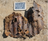  a piece of corrugated iron with shrapnel holes found at Lijssenthoek 