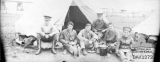 THORSEN HENRY JAMES (six members of the AAMC, one of them is HJ Thorsen, outside their tent)