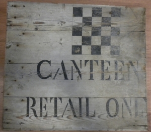 wooden signboard with inscription