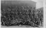 Hugh Glass smoking a pipe - 2nd row from back, 5th from right