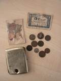 Wells C (cigarette box with shrapnel hole in it_money found on his body)