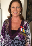 Karen Balstrup wearing the medals of Gordon on Anzac Day
