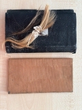 wallet containing diary and hairlocks
