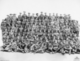 Pegram Albert George (55th Bn., 8th reinforcement, Pegram is sixth from left, third row from back)